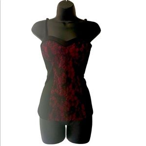 Corset style lace front top with adjustable spaghetti straps.Size medium
